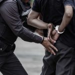 Police Officer Handcuffs A Man