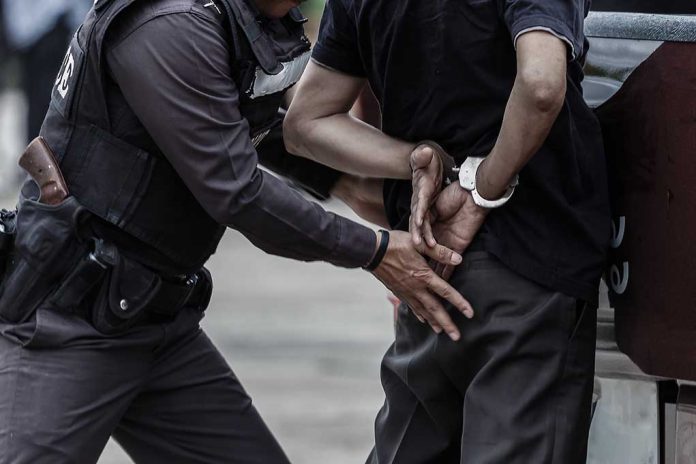 Police Officer Handcuffs A Man