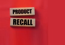 Product recall text on wooden blocks red background