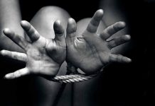 Hands tied with rope