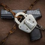 Gun in chains