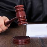 Judge's hammer and paperwork