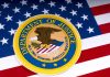Department of Justice emblem on the American flag