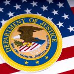 Department of Justice emblem on the American flag