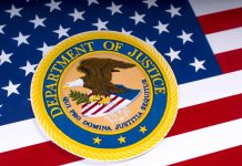 Department of Justice emblem on the American flag
