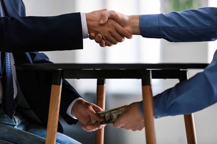 1225177960 featured image Handshake and money exchange