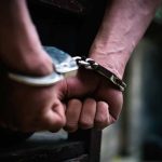 Hands in handcuffs