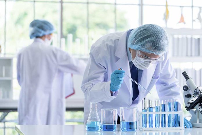 1365781304 featured image Scientists working in a laboratory with test tubes