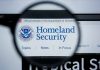 Magnifying glass showing Homeland Security website