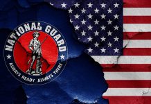 National Guard logo over a distressed American flag