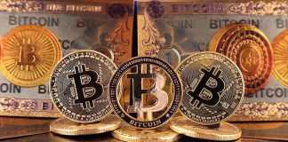 Bitcoins and Bitcoin-themed banknotes in various designs