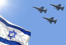 Israeli flag with three fighter jets flying overhead