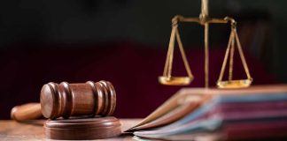 Judges gavel scales of justice and legal documents