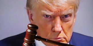 Gavel in front of a serious mans face