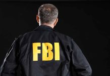 FBI agent with back facing the camera