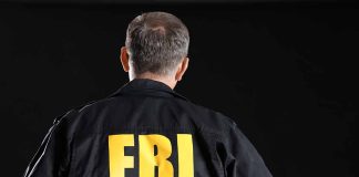 FBI agent with back facing the camera