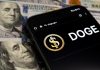 Smartphone displaying Doge logo on hundred dollar bills