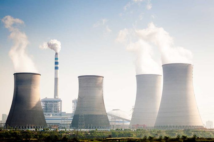 164603351 featured image Four cooling towers of a power plant emitting steam