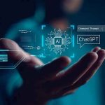 Hand holding digital AI and ChatGPT graphics