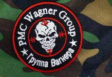 PMC Wagner Group patch on camouflage background