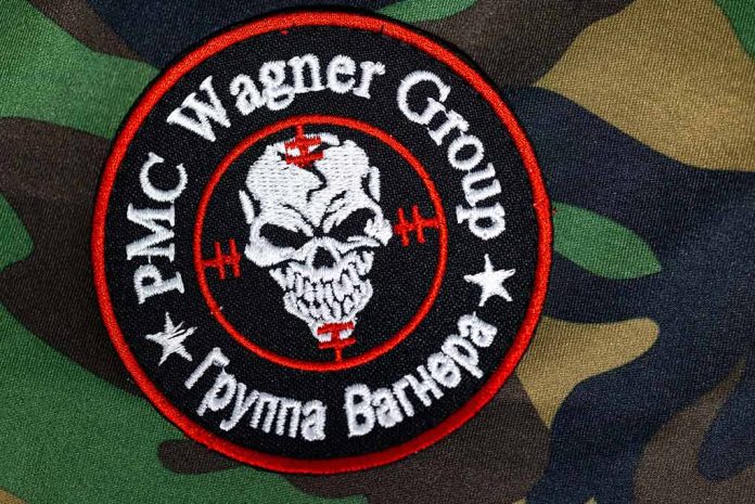 2324824963 featured image PMC Wagner Group patch on camouflage background