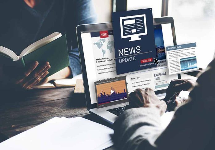430087837 featured image Person reading news on a laptop