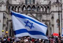 Israeli flag at a crowded outdoor event