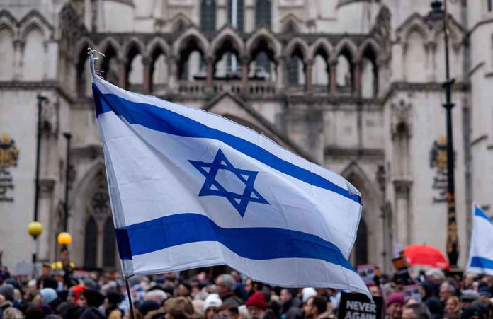 2393485591 Israeli flag at a crowded outdoor event