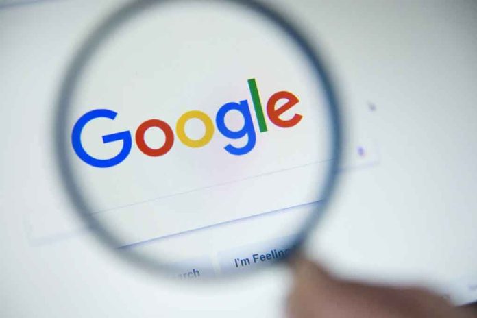 746561200 Google logo viewed through a magnifying glass.