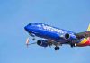 Southwest Airlines plane flying in blue sky