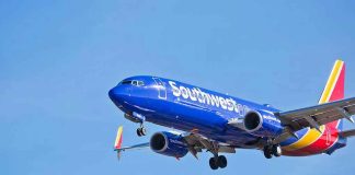 Southwest Airlines plane flying in blue sky