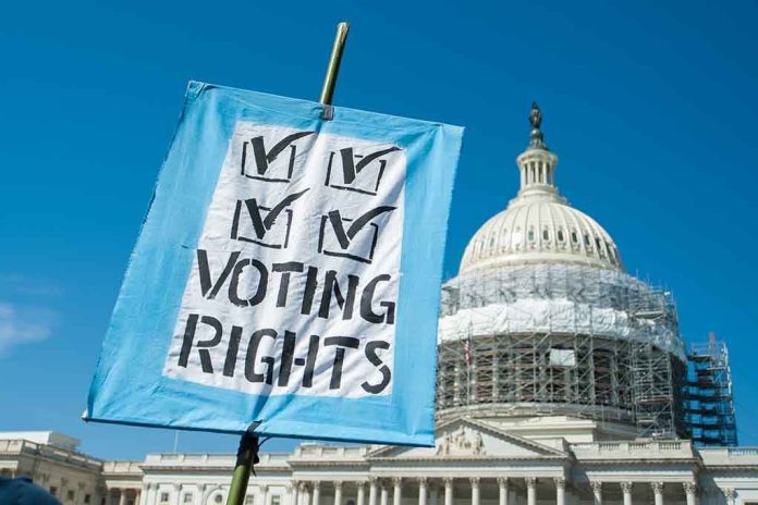 Sign reading "Voting Rights" in front of Capitol building.