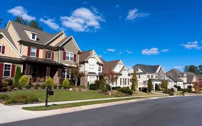 shutterstock_161232668.jpg A row of modern suburban houses under a clear blue sky