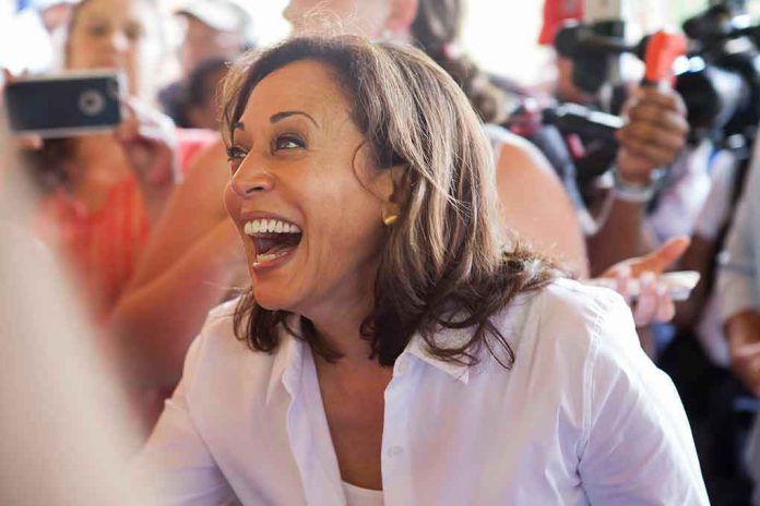 Woman laughing, surrounded by people with cameras.