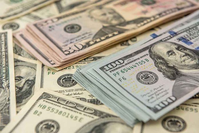 1936085086 Stacks of various US dollar bills