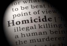 Magnified text showing definition of homicide.
