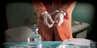 Vial labeled Sodium Thiopental near handcuffed person.