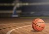 A basketball on a wooden court