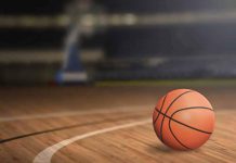A basketball on a wooden court