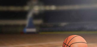 A basketball on a wooden court