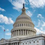 US Capitol building dome under clear blue sky