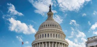 US Capitol building dome under clear blue sky