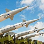 America’s Arsenal Crisis—Stunning Pentagon Warning Multiple missiles pointed upward on launchers against blue sky