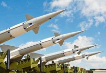 America’s Arsenal Crisis—Stunning Pentagon Warning Multiple missiles pointed upward on launchers against blue sky