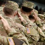 US MILITARY SCANDAL: Troops Living With RATS! Soldiers in camouflage uniforms saluting in formation outdoors