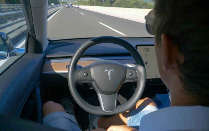 1725105379 Man using autopilot mode in a Tesla car