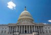 PAYCHECK HYPOCRISY: Lawmakers Cash In During Shutdown U.S. Capitol building against a clear blue sky.