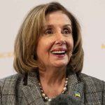 Pelosi DEFENDS Death Threats Against GOP Kids Smiling woman in plaid blazer with pearl necklace