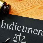 Dem Candidate INDICTED — ICE Obstruction Charges Gavel next to indictment document on table