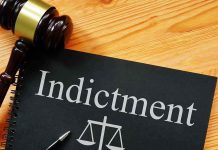 Dem Candidate INDICTED — ICE Obstruction Charges Gavel next to indictment document on table